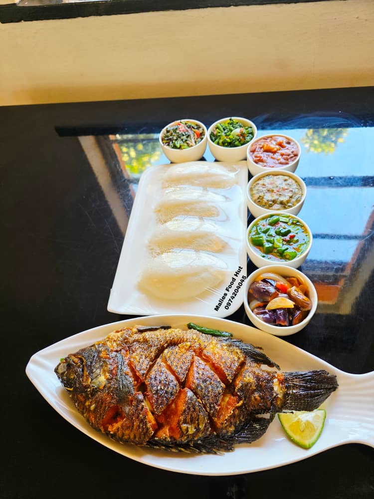 Whole fried fish with beans and nsima at Malies Food Hut
