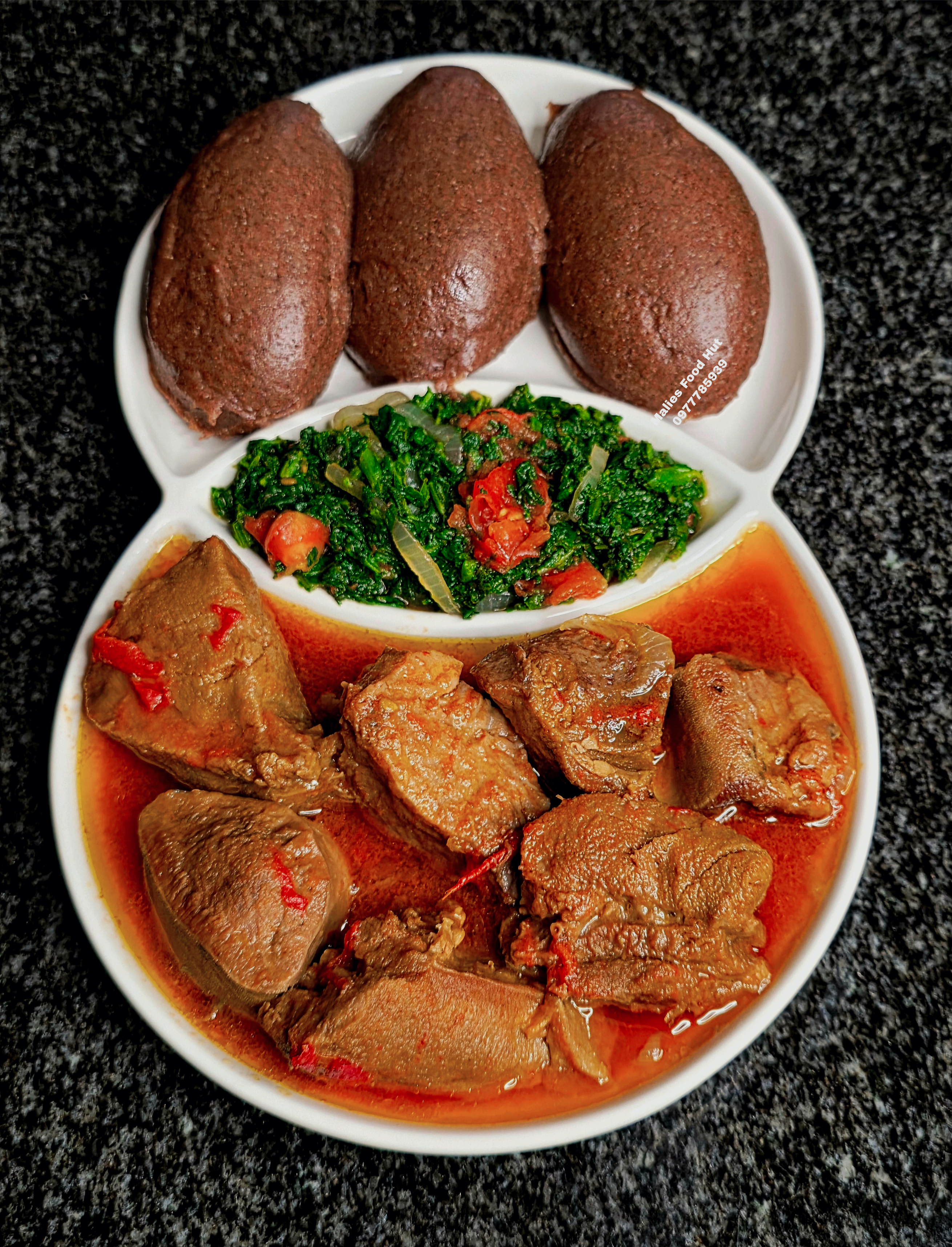 Three nsima balls with tripe stew