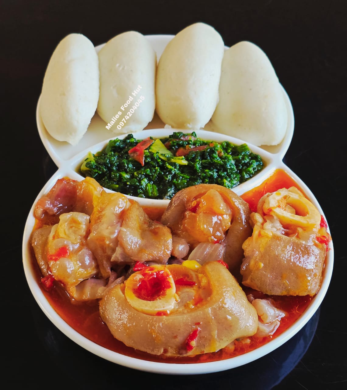 Chicken trotters in red sauce with nsima