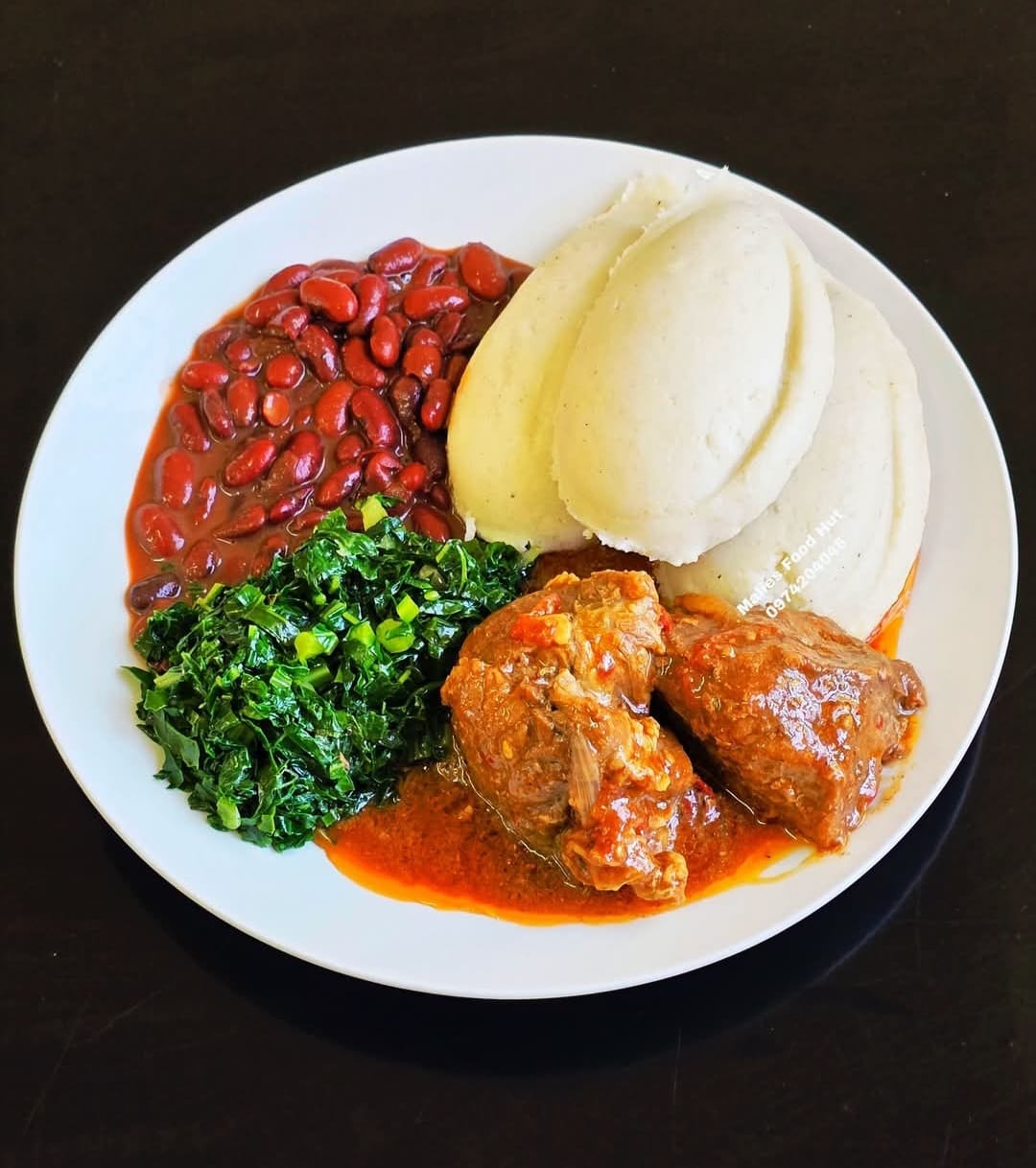 Beef stew with beans, rape and nsima