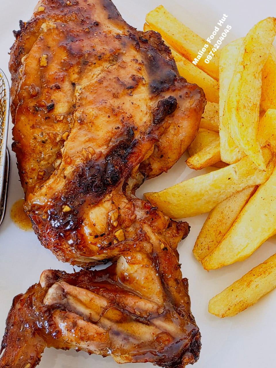 Grilled chicken quarter with fries