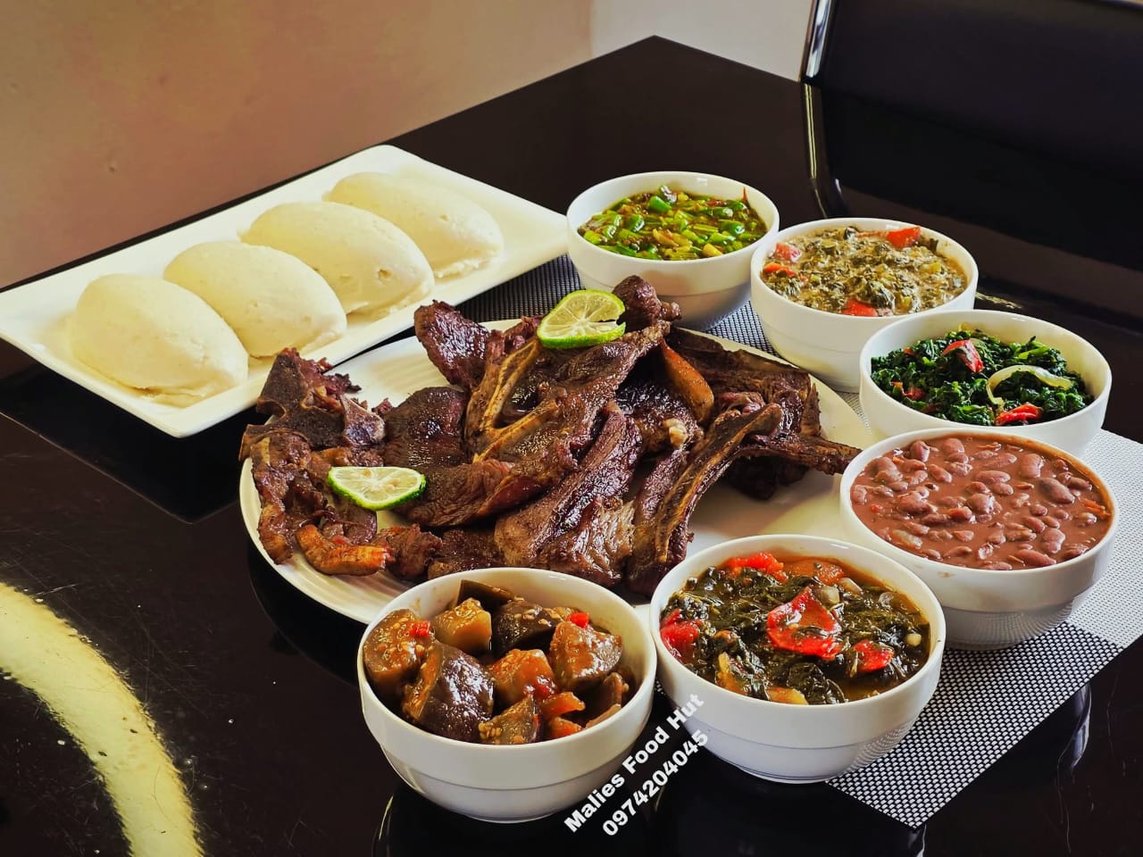 Mixed grilled meat platter with relish bowls